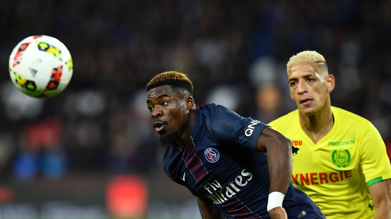 Serge Aurier (L) in action for Paris Saint-Germain