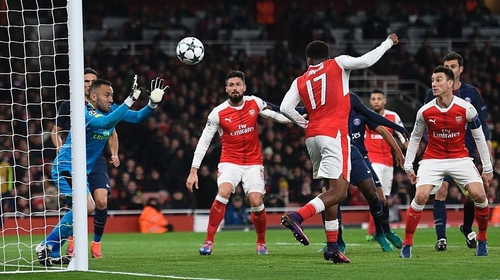 Alex Iwobi (17) diverts the ball past his own goalkeeper for PSG's equaliser
