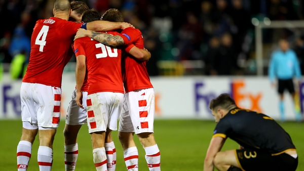 AZ Alkmaar players celebrate at the full-time whistle