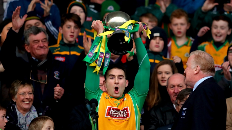 Corofin's captain Alan Burke lifts the trophy