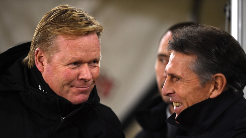 Koeman speaks to his successor as Saints manager Claude Puel before kick-off