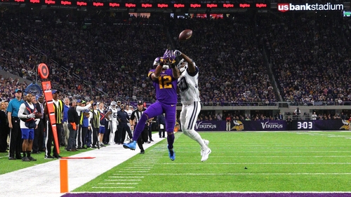 Anthony Brown of the Dallas Cowboys breaks up a pass to Charles Johnson of the Minnesota Vikings