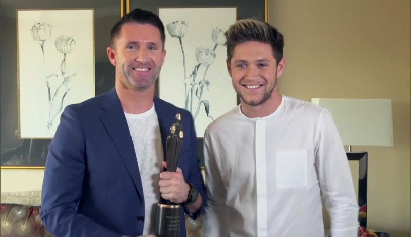 Robbie Keane receives his People of the Year Award from One Direction's Niall Horan in Los Angeles