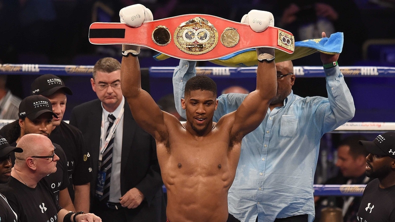 Joshua in the ring with his IBF world heavyweight champion's belt