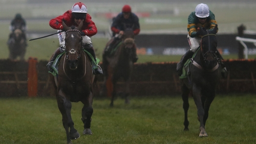 Richard Johnson riding The New One (L) clears the last to win The International Hurdle from My Tent Or Yours (R)