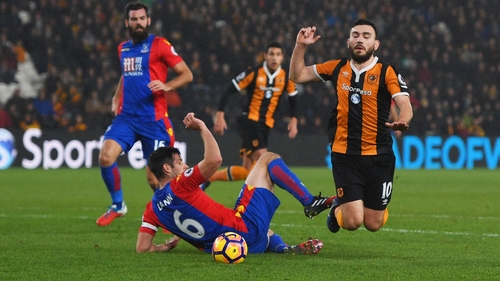 Robert Snodrass (R) goes down in the Crystal Palace box