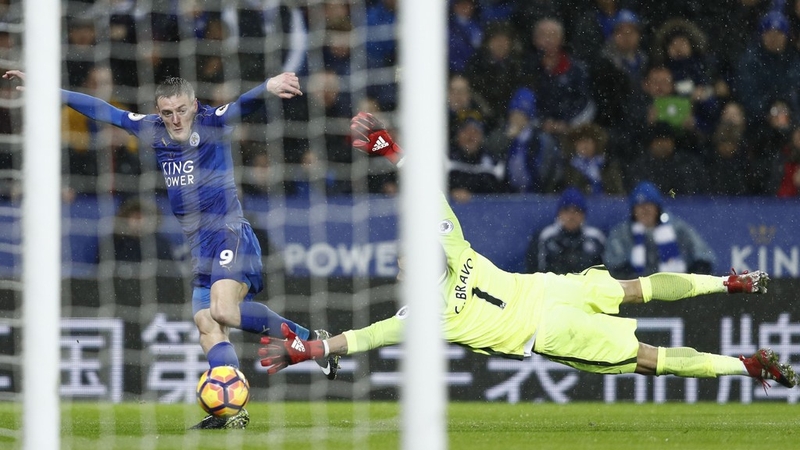Jamie Vardy slides home against City