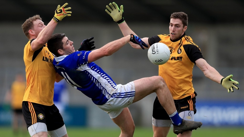 Ulster's Aiden Breen and Eoin Donnelly tangle with Paul White of Munster