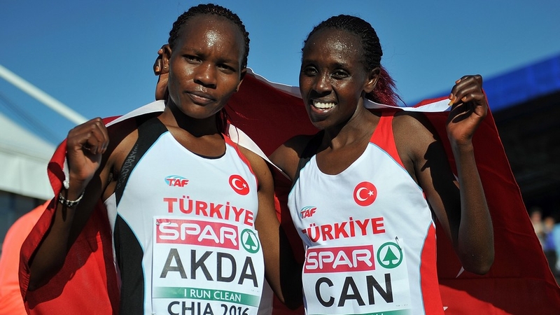 Silver medallist Meryem Akda and gold medallist Yasemin Can of Turkey pose after the European Cross Country Championships