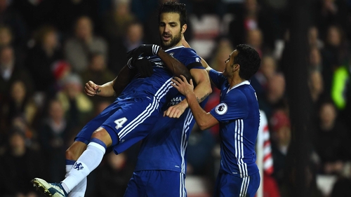 Cesc Fabregas and his team-mates celebrate the only goal of the game at the Stadium of Light