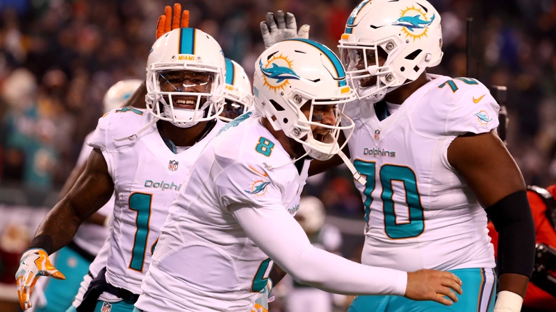 Matt Moore eased the Dolphins into the final wild-card spot in the AFC