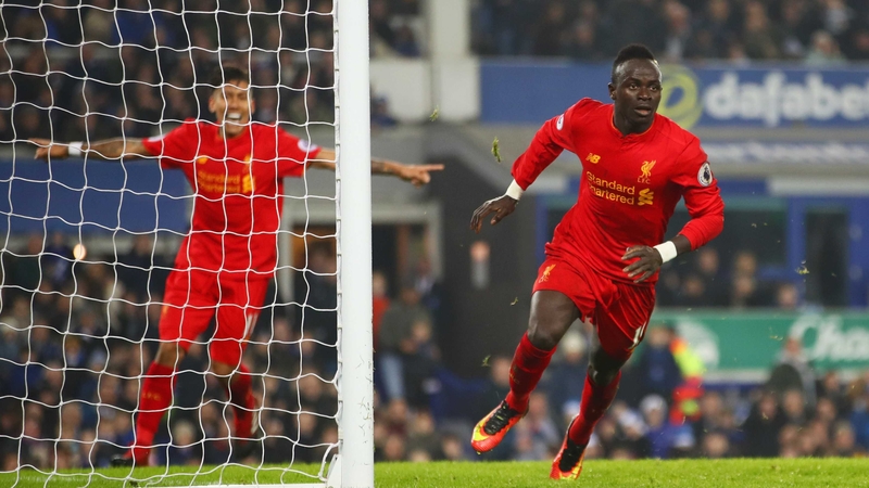 Sadio Mane heads off in celebration