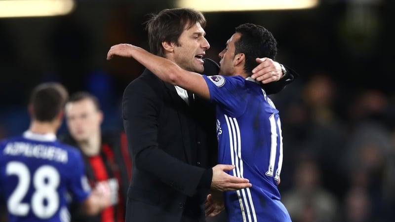 Antonio Conte embraces goalscorer Pedro after the clash with Bournemouth