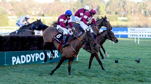 Outlander (near side) leads a trio of Gigginstown-owned runners over the final fence at Leopardstown