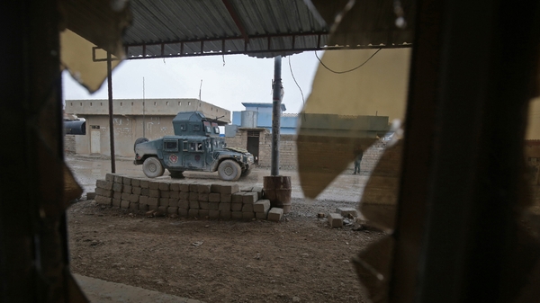 Iraqi pro-government forces patrol the eastern part of the embattled Iraqi city of Mosul