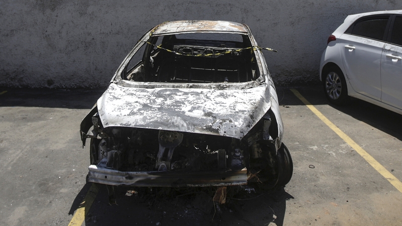The burnt-out car which the Greek ambassador to Brazil rented