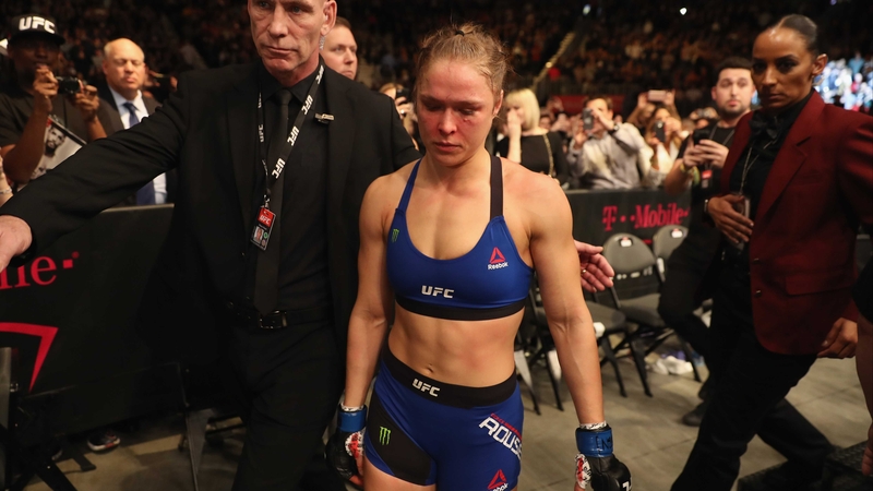 A deflated Ronda Rousey leaves the octagon