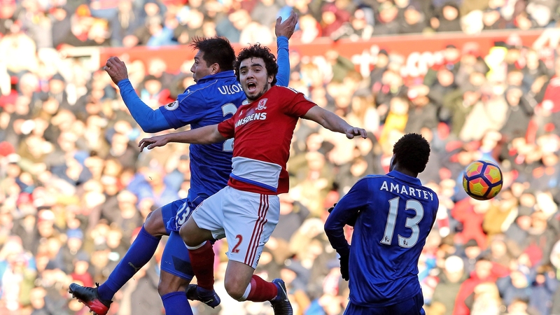 Leonardo Ulloa of Leicester Cit and Fabio Da Silva of Middlesbrough battle to win a header