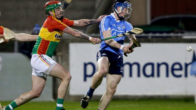 Cian O'Sullivan scores Dublin's first goal despite the attention of Carlow's Paul Doyle