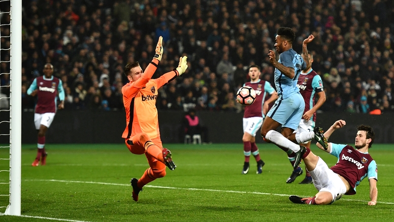 Havard Nordtveit steers the ball into his own net under pressure from Raheem Sterling