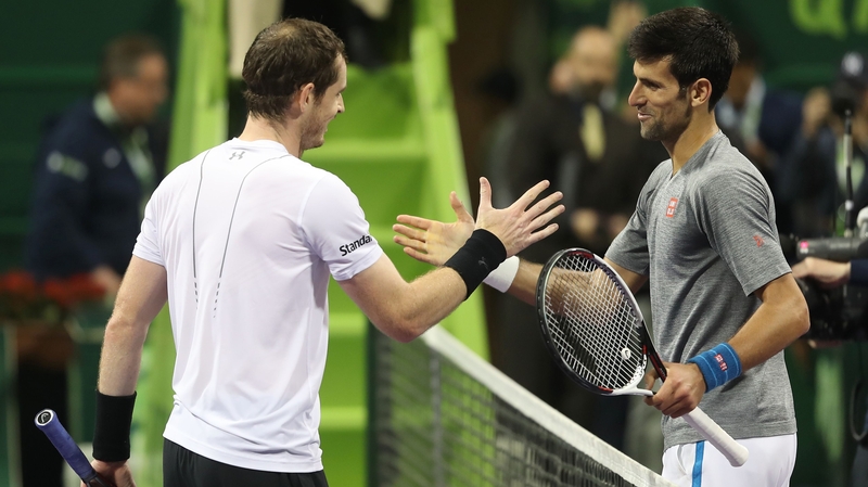 Murray (L) congratulates Djokovic after their thrilling final in Doha