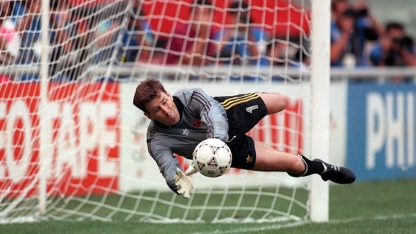 Packie Bonner palms away Daniel Timofte's penalty in Genoa
