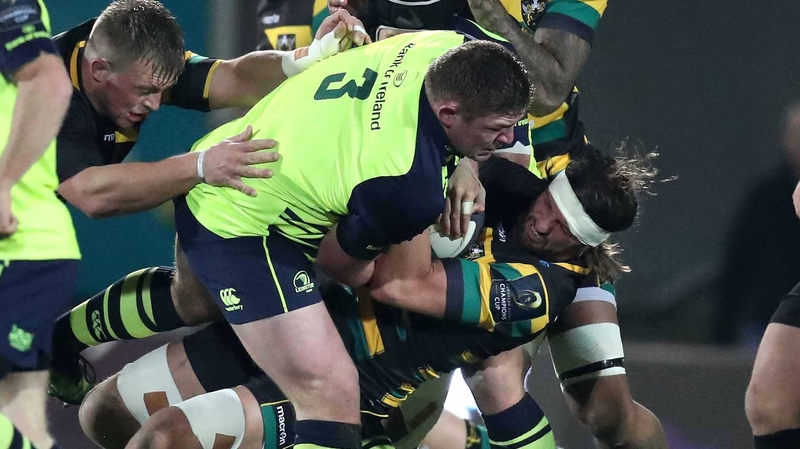 Leinster's Tadgh Furlong and Northampton's Tom Wood tussle for possession