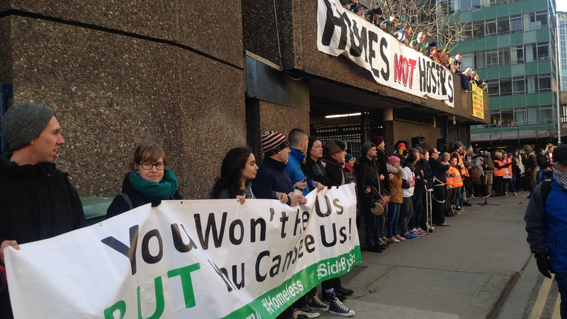 Supporters of the Home Sweet Home group gather outside the building