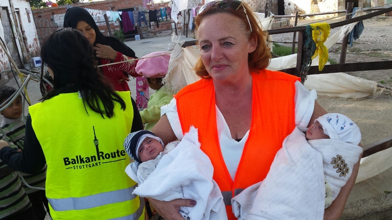 Anne O'Rorke helping to care for eight-week-old twins during her volunteer work in Izmir