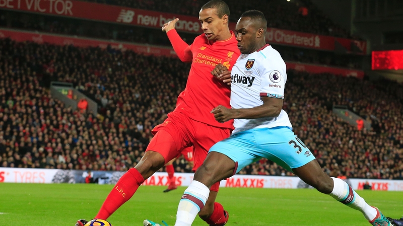 Joel Matip tackles West Ham's Michail Antonio at Anfield in December