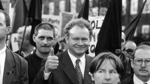 McGuinness gives a thumbs up during a march in North London to commemorate the 25th anniversary of Bloody Sunday in 1997