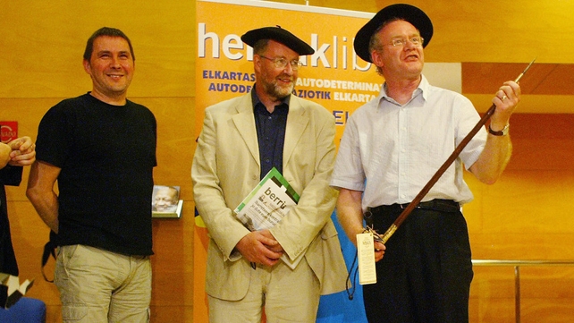 McGuinness holds a 'Makila' as he is pictured alongside Batasuna leader Arnaldo Otegi (L) in Pamplona in June 2006