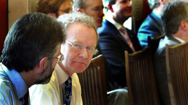 Adams looks past McGuinness prior to the start of the Good Friday Review in 2004
