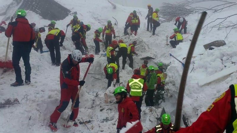 Soccorso Alpino volunteers and rescuers work at the hotel site in Rigopiano, Italy
