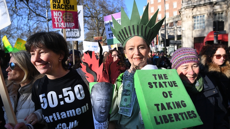 Protesters dress up for the Women's March in London