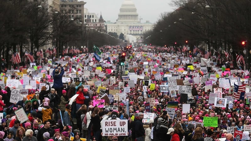 Protesters attend the Women's March on Washington, with the US Capitol in the background