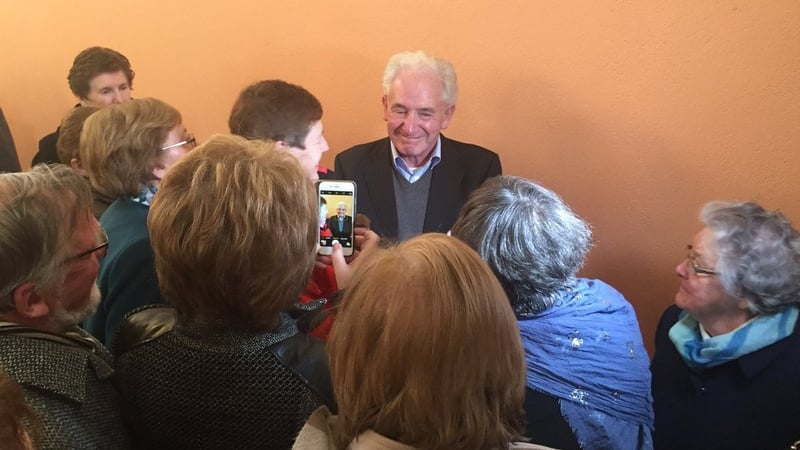 Crowds of wellwishers greet Fr Tony Flannery after he concluded this afternoon's mass in Galway