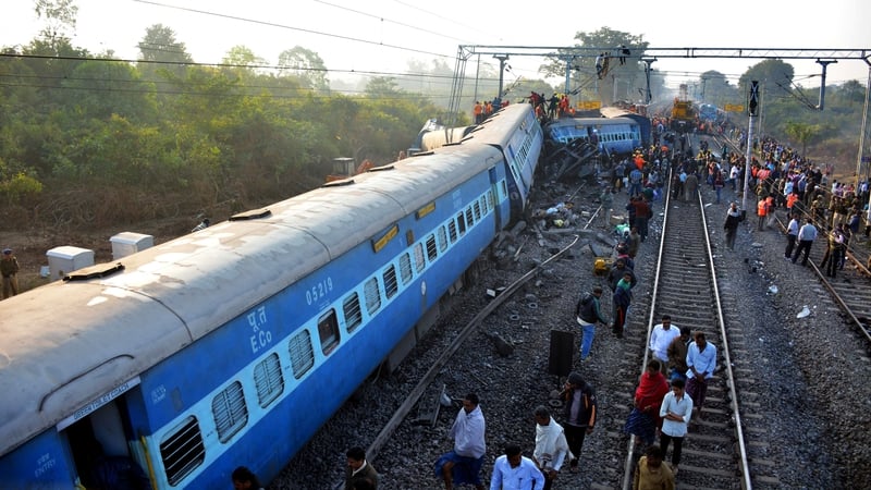 Indian rescue workers search for survivors at the site of the derailment