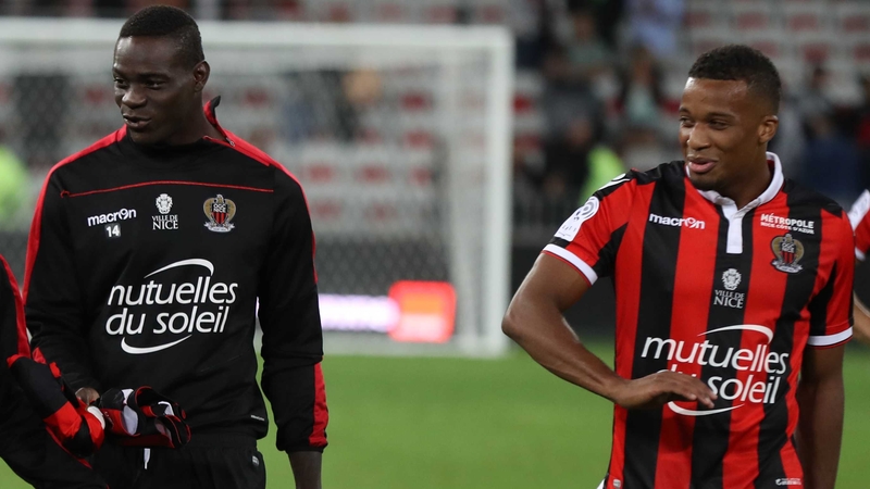 Mario Balotelli (L) and his French team mate Alassane Plea