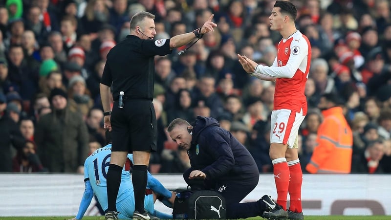 Granit Xhaka sees red for his challenge on Burnley's Steven Defour
