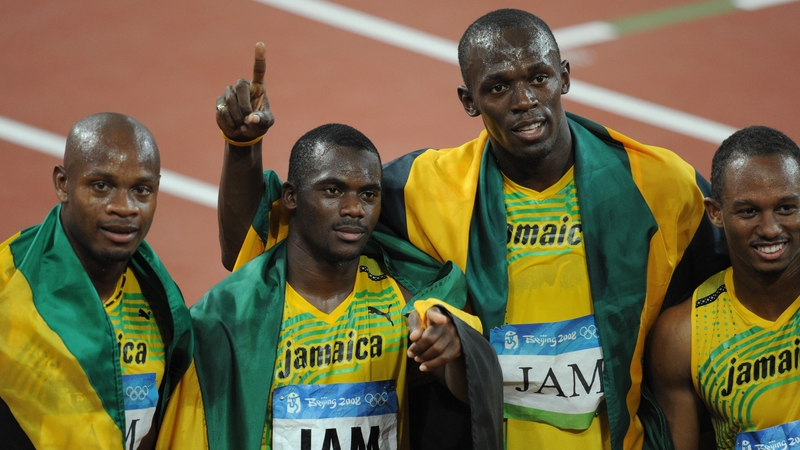 Jamaica's Asafa Powell, Nesta Carter, Usain Bolt and Michael Frater celebrate gold in 2006