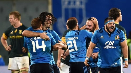 Italy players celebrate November's win over South Africa