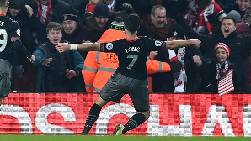 Shane Long celebrates with the travelling Southampton fans at Anfield