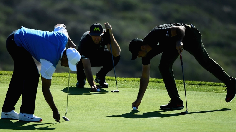 Tiger Woods; Dustin Johnson and Jason Day prepare to putt