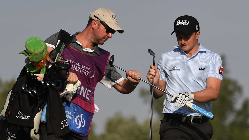 Paul Dunne (R) is six off the lead at the Qatar Masters