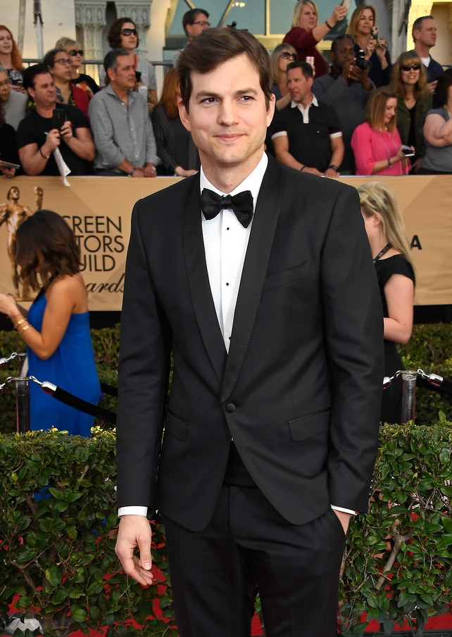 SAG host Ashton Kutcher pictured on the red carpet before opening the ceremony speaking out against Trump's Immigration Ban.