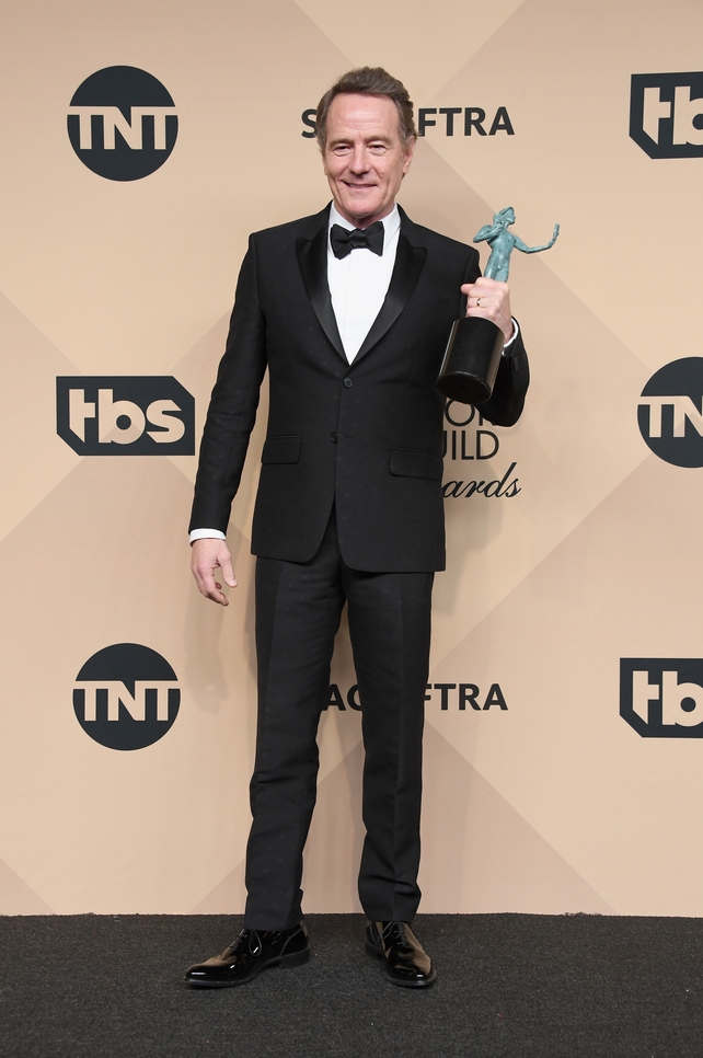 Bryan Cranston looks dashing and cute with his slightly twisted dickie bow with his award for Outstanding Performance by a Male Actor in a Miniseries or Television Movie for 'All the Way'.