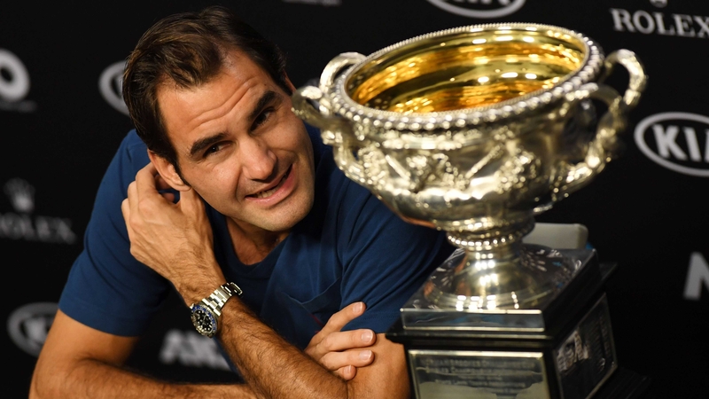 Roger Federer with the Australian Open Championship trophy