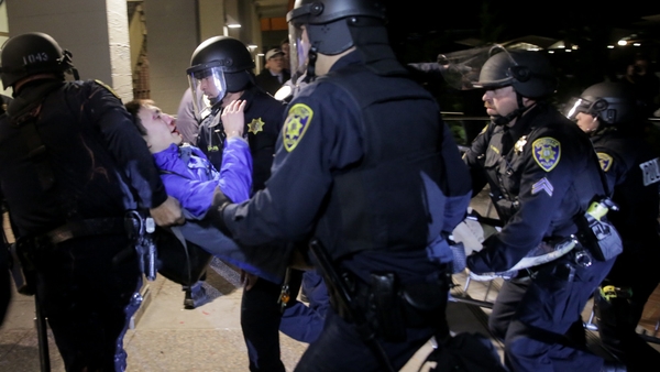 Riot police carry a protester away during the demonstrations