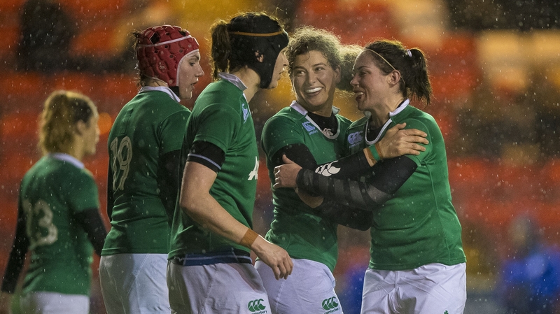 Jenny Murphy celebrates with her team mates after her match-winning try